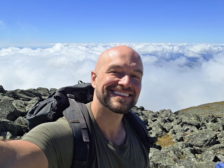 Ryan Connors hiking above the clouds in New Hampshire